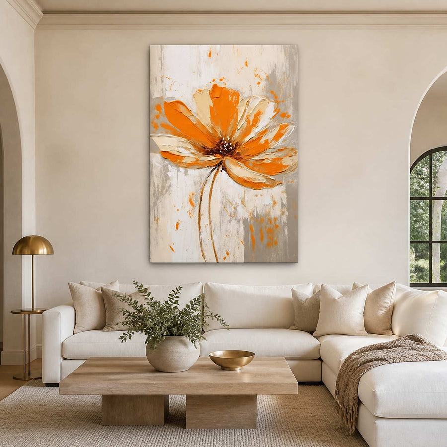 Frameless orange floral painting above a cream sectional sofa and pale wood coffee table.