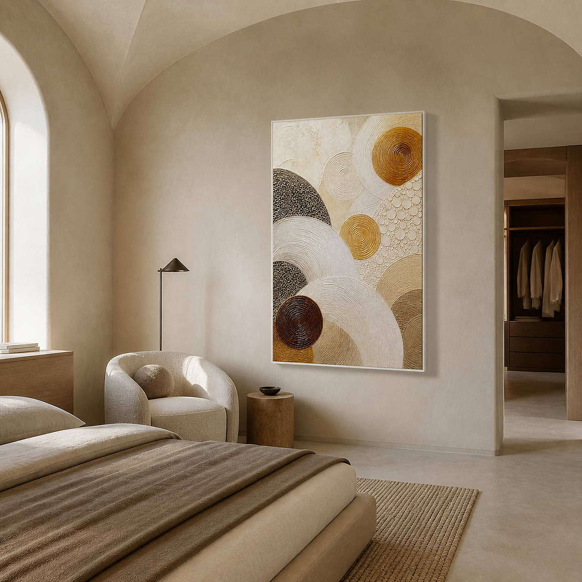 Layered circles in gold, brown, and ivory wall art in a contemporary bedroom.