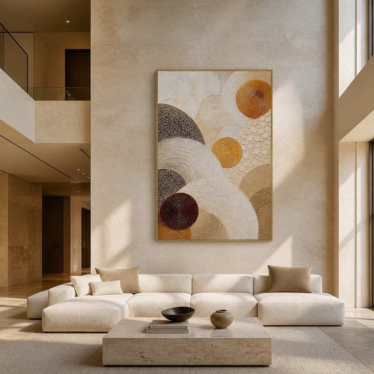Layered circles in gold, brown, and ivory wall art in a contemporary living room.