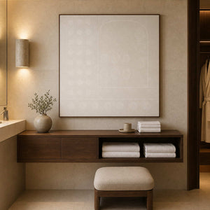 Neutral relief wall art in a warm boutique hotel bathroom.