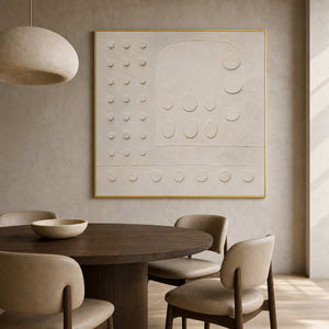Minimalist ivory relief artwork above an organic modern dining table.