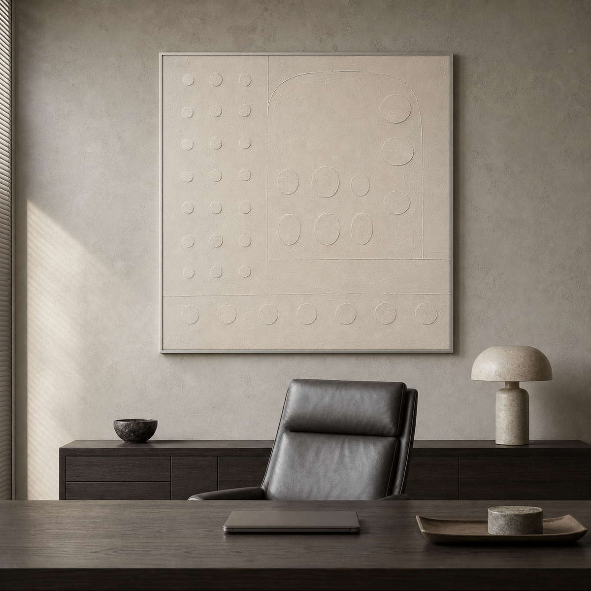 Textured ivory abstract artwork in a refined minimalist office.