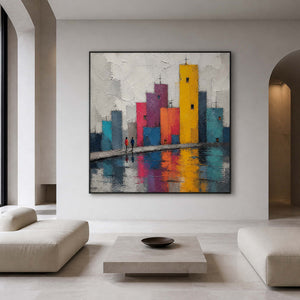 Textured colorful cityscape displayed in a contemporary gallery lounge.