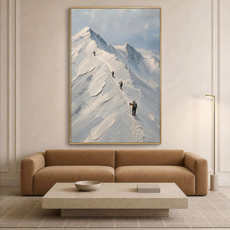 Textured mountain wall art with climbers in a warm modern living room.