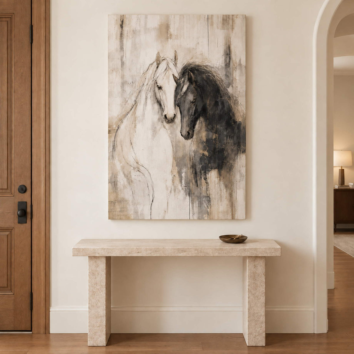 A white horse and a dark horse leaning close on an ivory ground without an outer frame, displayed above an entryway console.