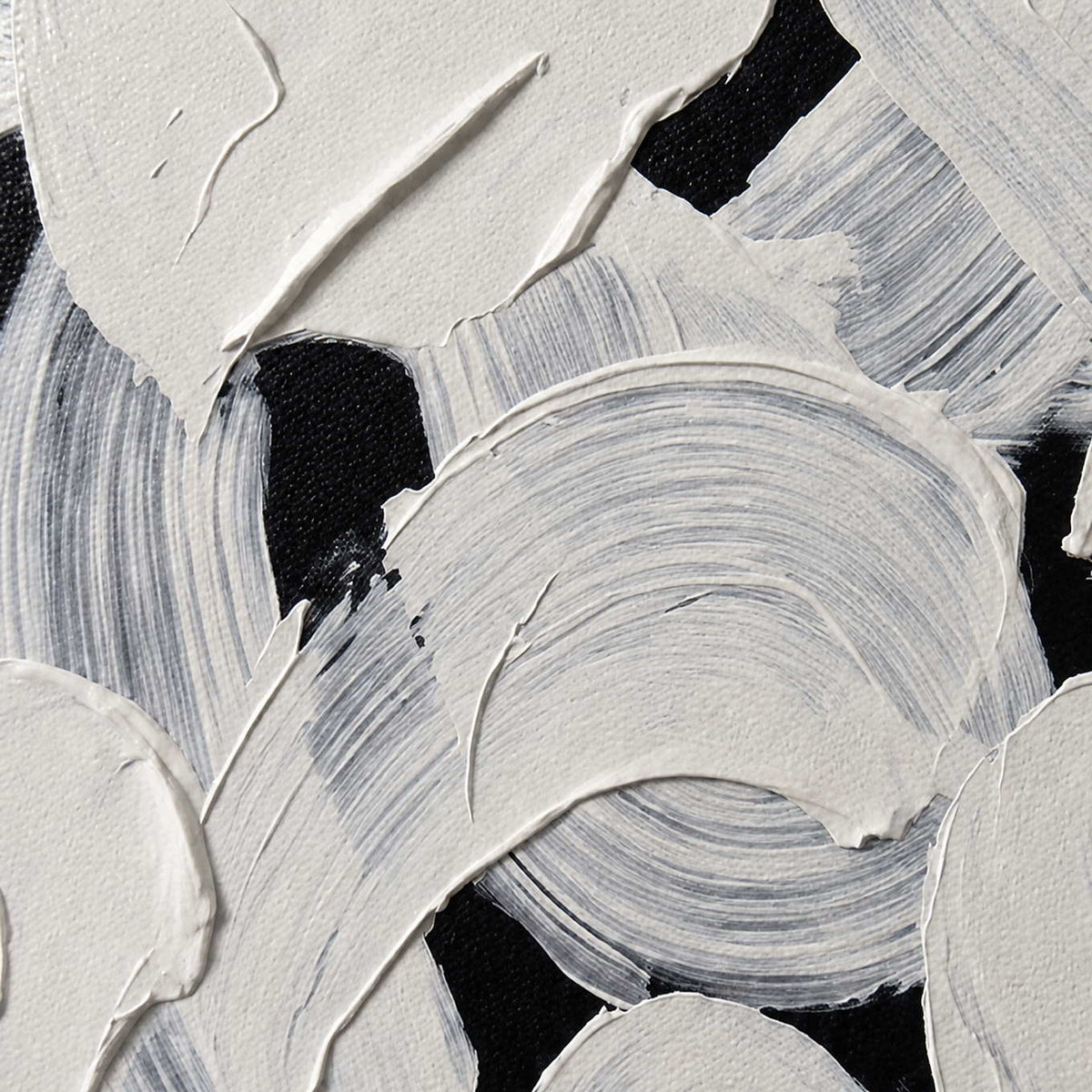 Close view of raised white paint and curved bristle marks revealing black beneath.