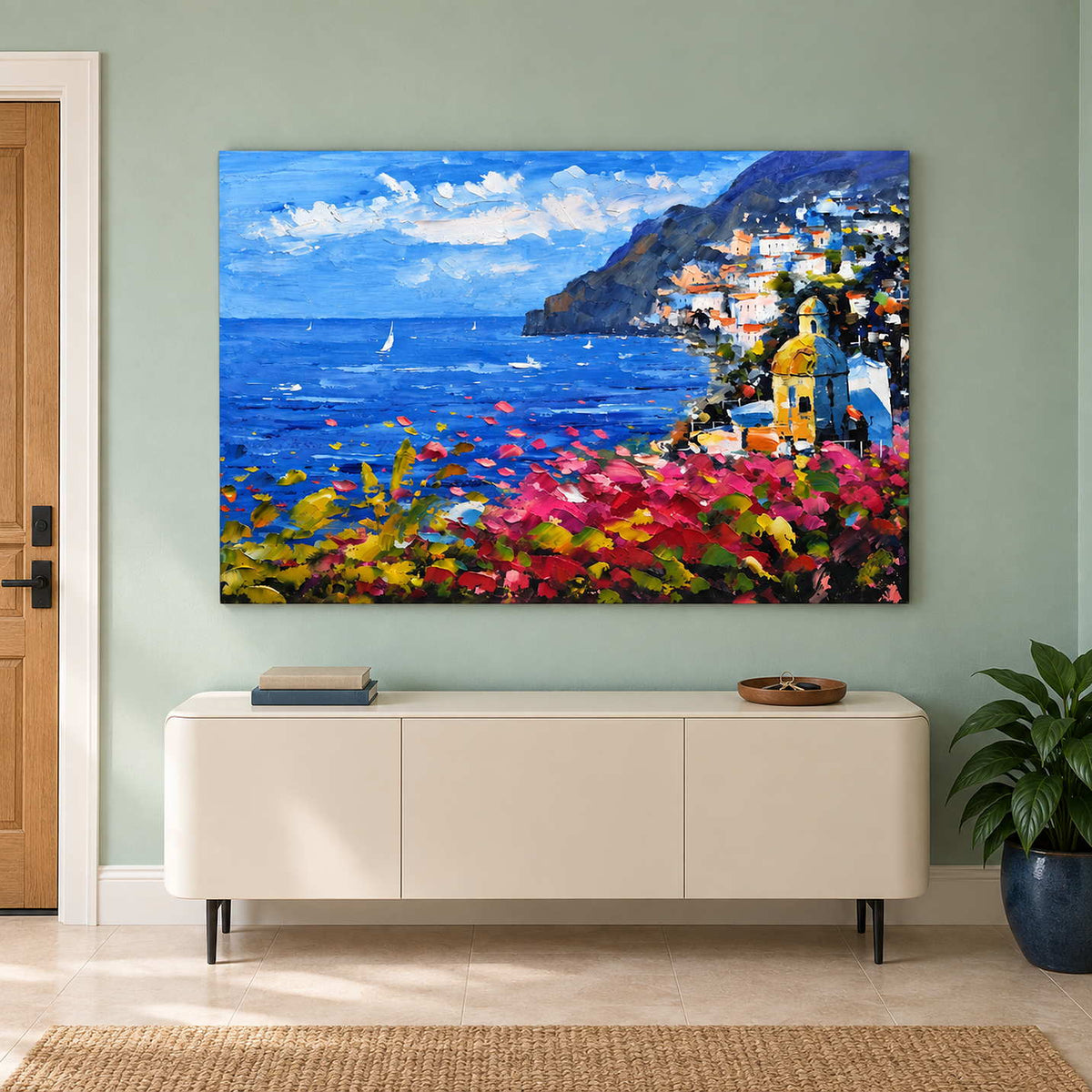 Colorful coast painting above a rounded white cabinet.