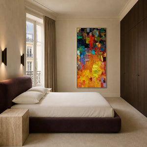 Colorful vertical abstract wall art displayed in a refined modern bedroom.
