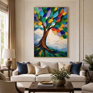 Colorful textured tree wall art above a neutral living room sofa.