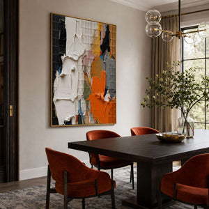Orange and black abstract canvas in a refined dining room.