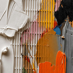 Close-up of raised white relief and orange paint texture.