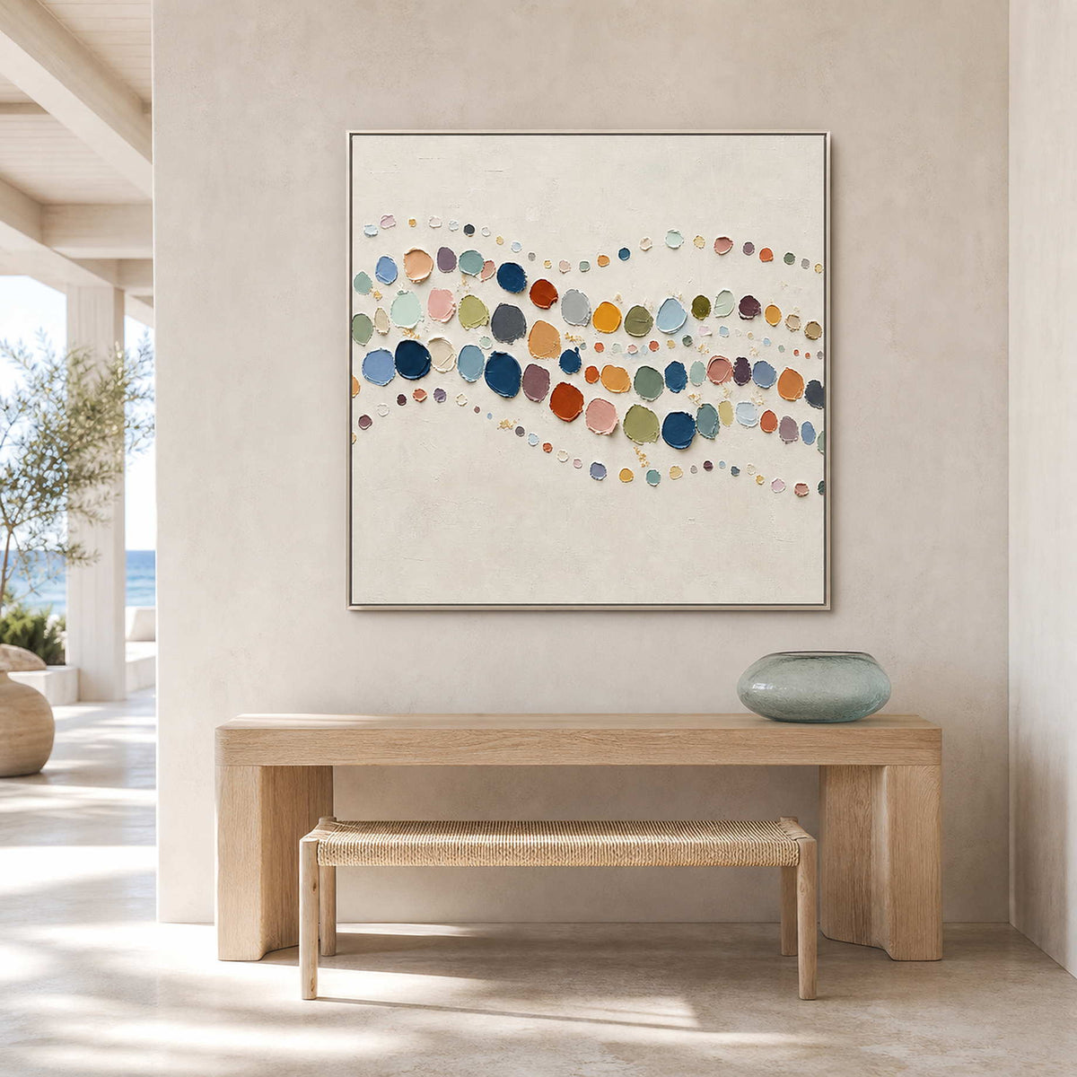 Colorful abstract canvas styled above a bright entryway console.