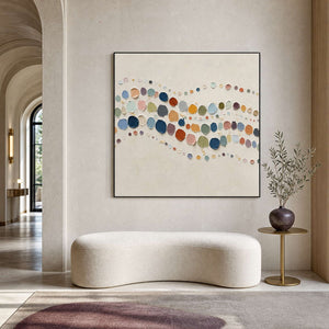 Colorful textured abstract wall art in a refined hotel lobby.