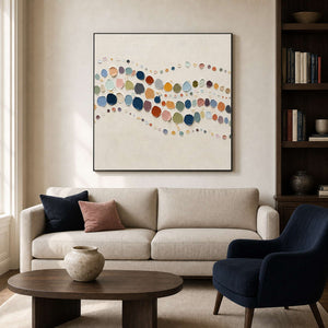 Textured abstract wall art above a warm modern living room sofa.