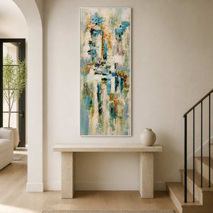 Extra-tall abstract wall art displayed above a pale entryway console.