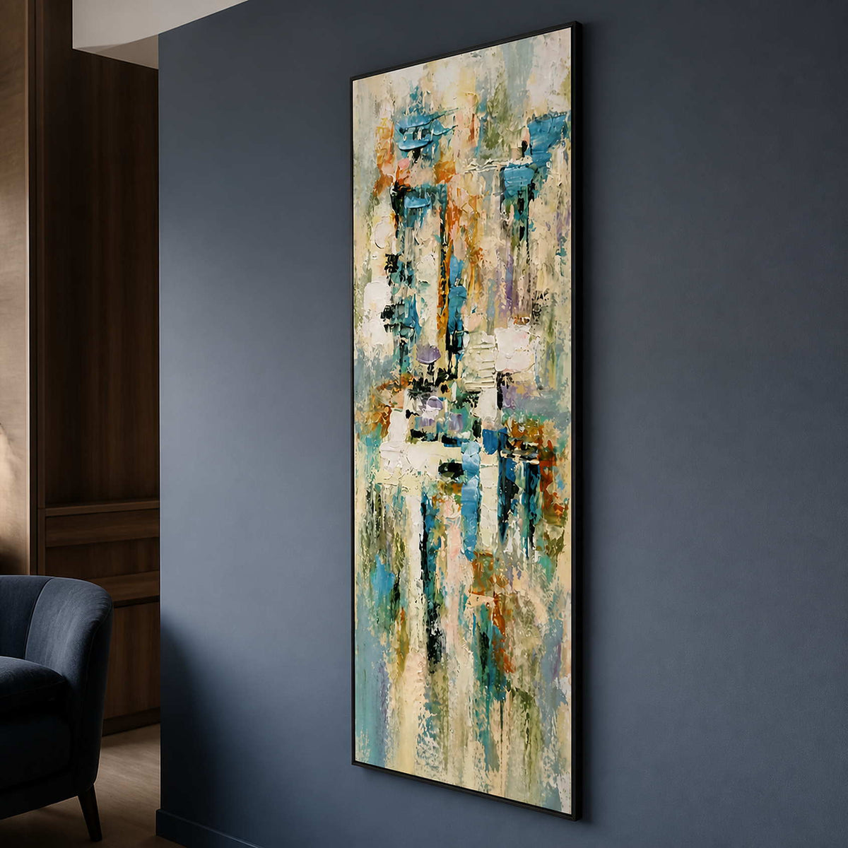 Tall abstract painting displayed against a deep blue-gray lounge wall.