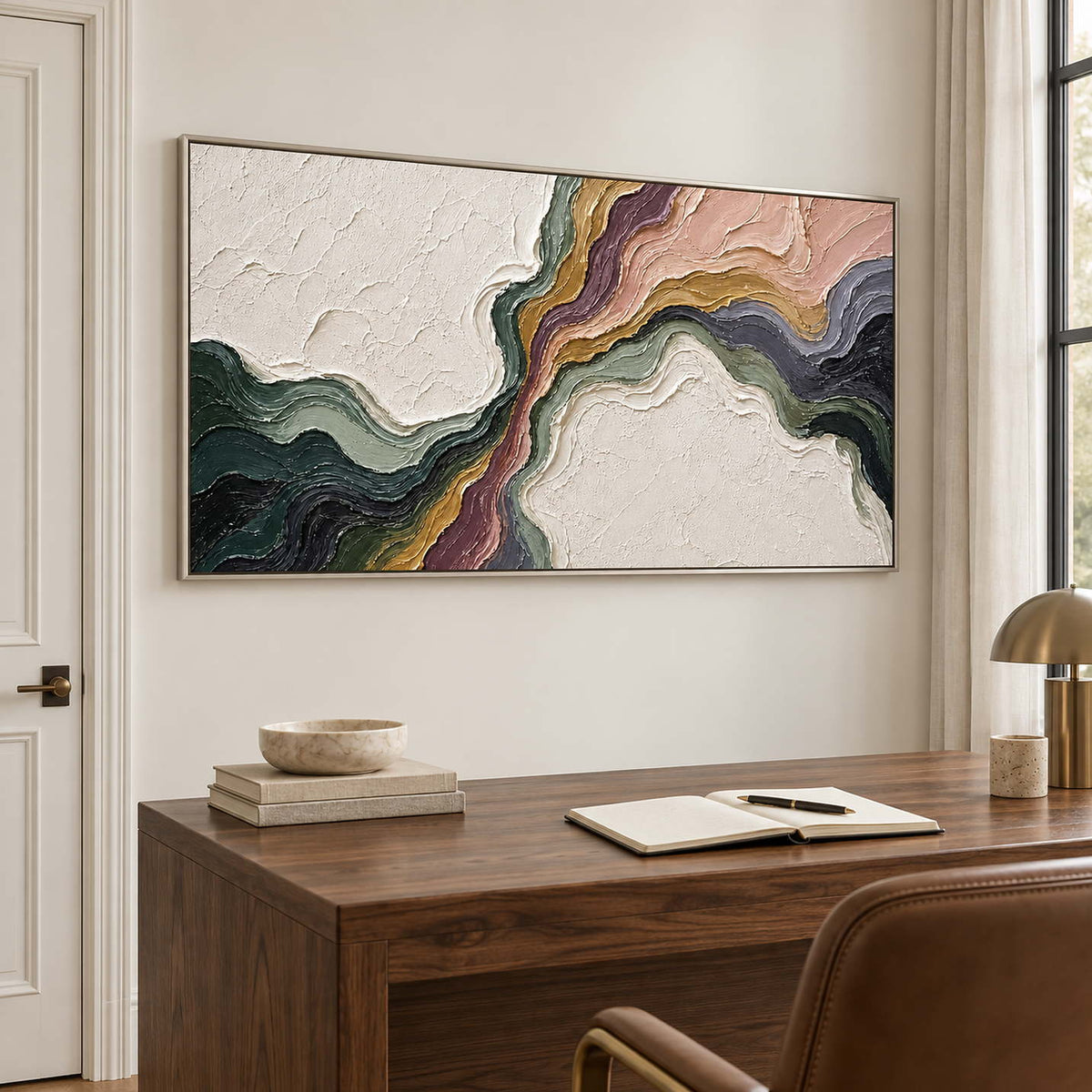 Flowing green, blush, ochre and charcoal bands through white texture in a silver frame, displayed in a home office.