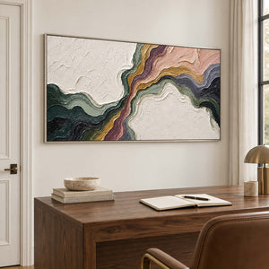 Flowing green, blush, ochre and charcoal bands through white texture in a silver frame, displayed in a home office.