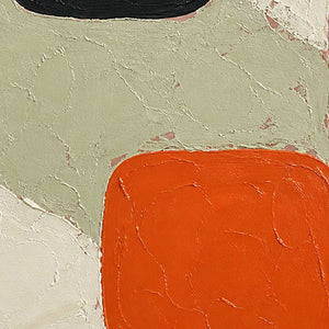 Close detail of orange blocks and cracked ivory textured surface