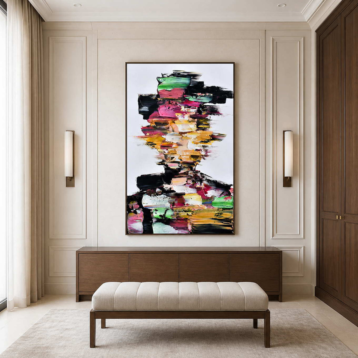 Wood framed colorful portrait above a walnut cabinet and upholstered bench beside dark wardrobes.