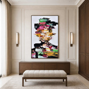 Wood framed colorful portrait above a walnut cabinet and upholstered bench beside dark wardrobes.