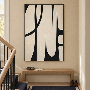 Cream and black abstract painting with elongated forms and a sweeping arc in a black frame on a stair landing.