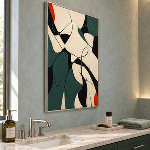 Deep green, black, and cream abstract painting with curved lines and red accents in a silver frame beside a bathroom vanity.