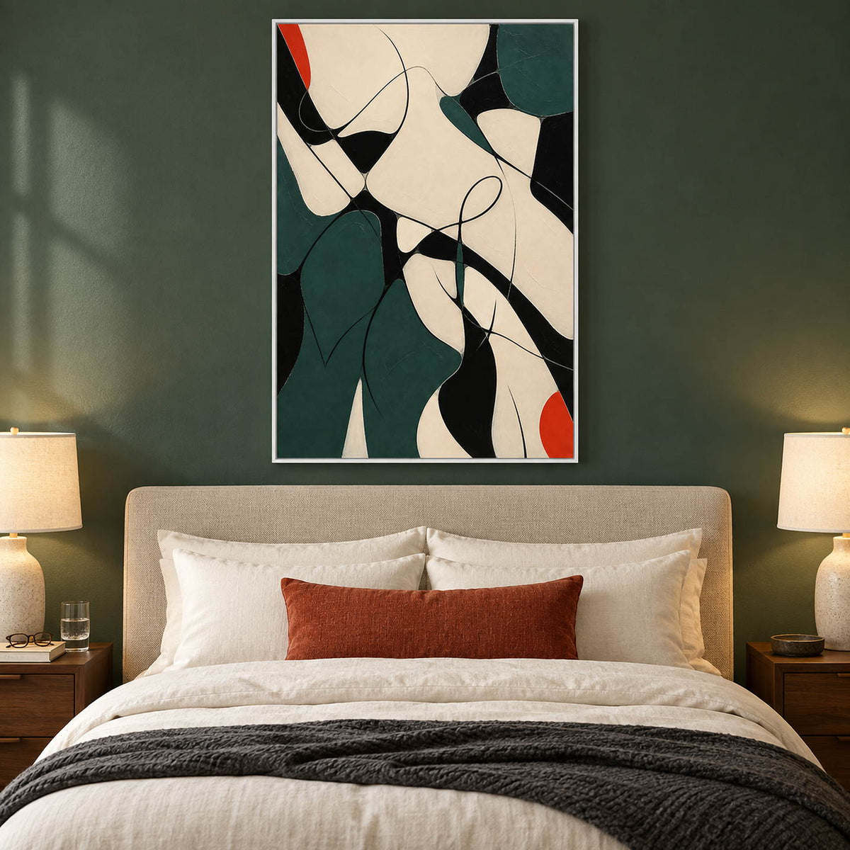 Deep green, black, and cream abstract painting with curved lines and red accents in a white frame in a bedroom.