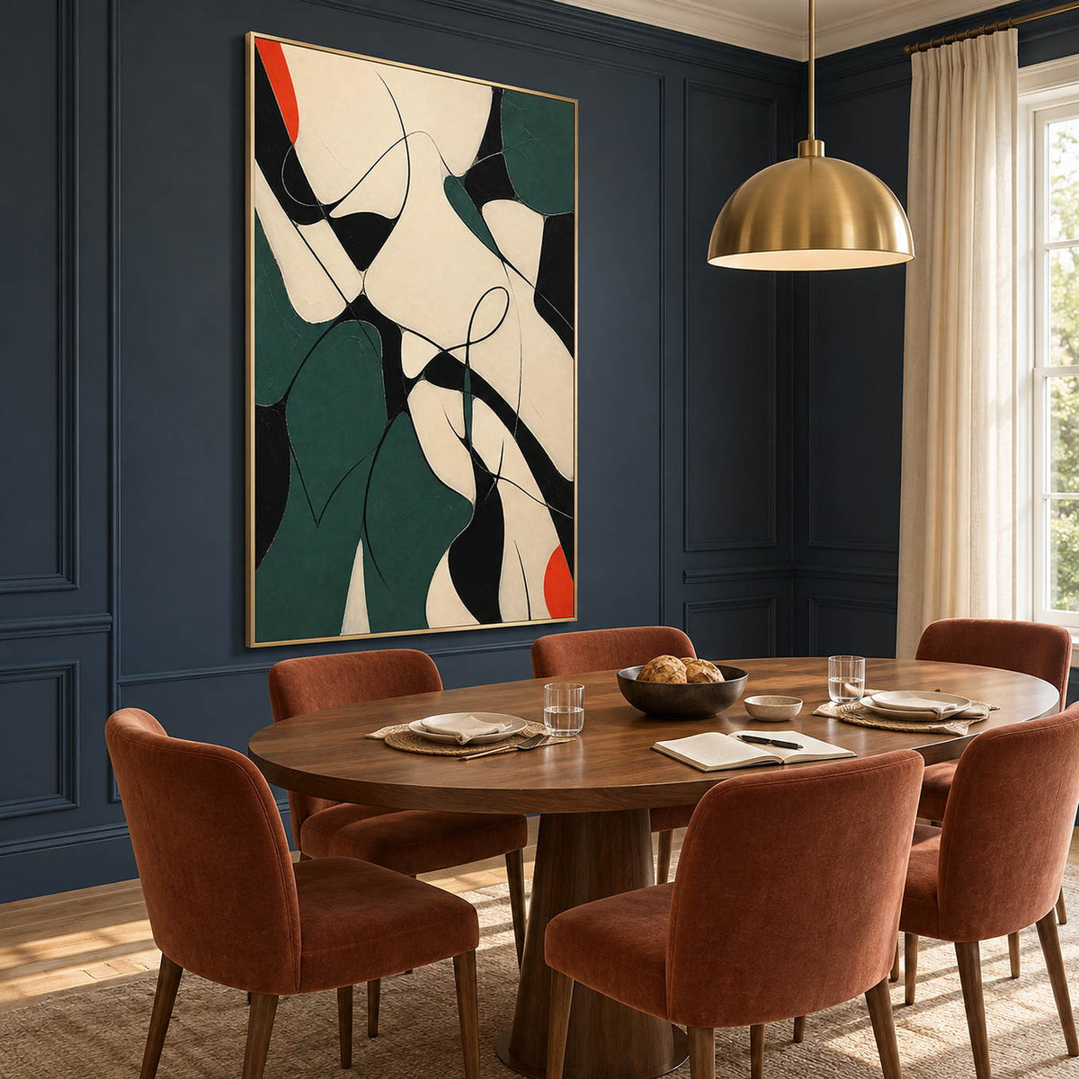 Deep green, black, and cream abstract painting with curved lines and red accents in a gold frame in a dining room.
