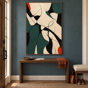 Deep green, black, and cream abstract painting with curved lines and red accents in a brown wood frame in an entryway.