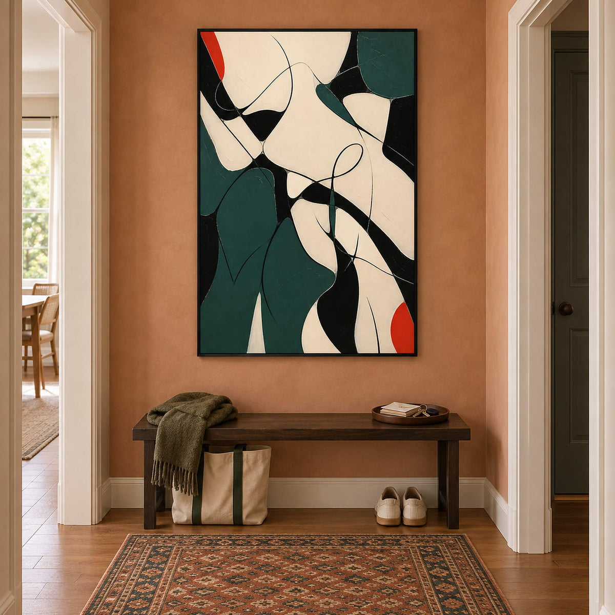 Deep green, black, and cream abstract painting with curved lines and red accents in a black frame in a hallway.