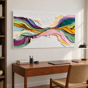 Flowing abstract over a wooden desk with a woven chair.