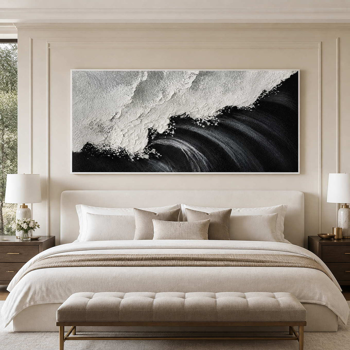 White framed panoramic wave artwork above a pale upholstered bed.