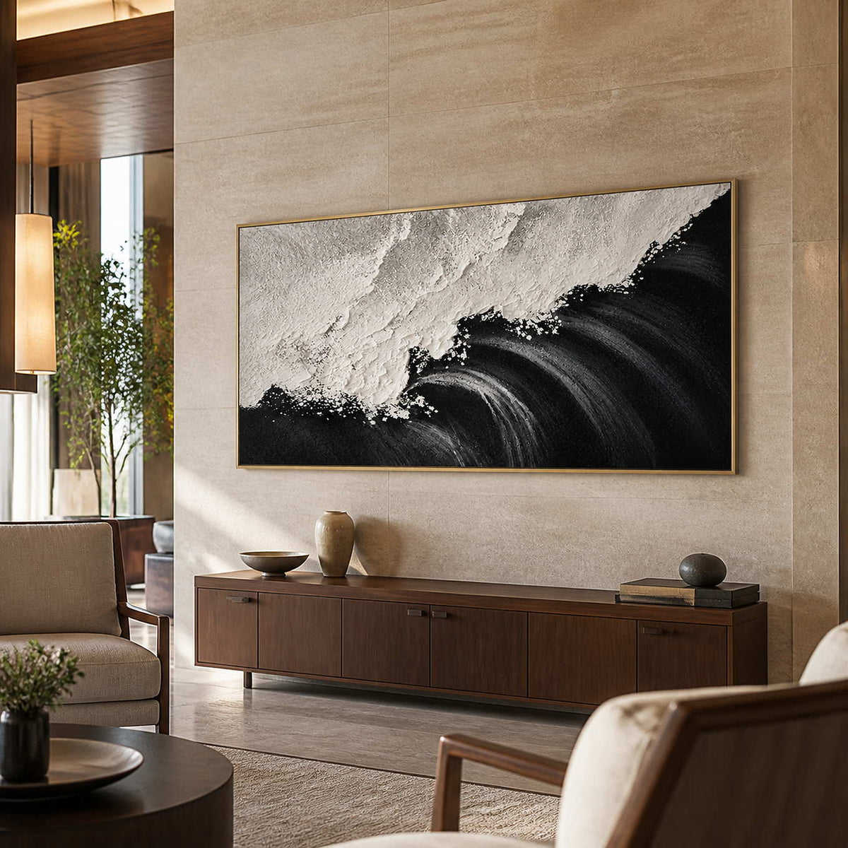 Gold framed panoramic coastal painting with rolling waves above a hotel lobby console.