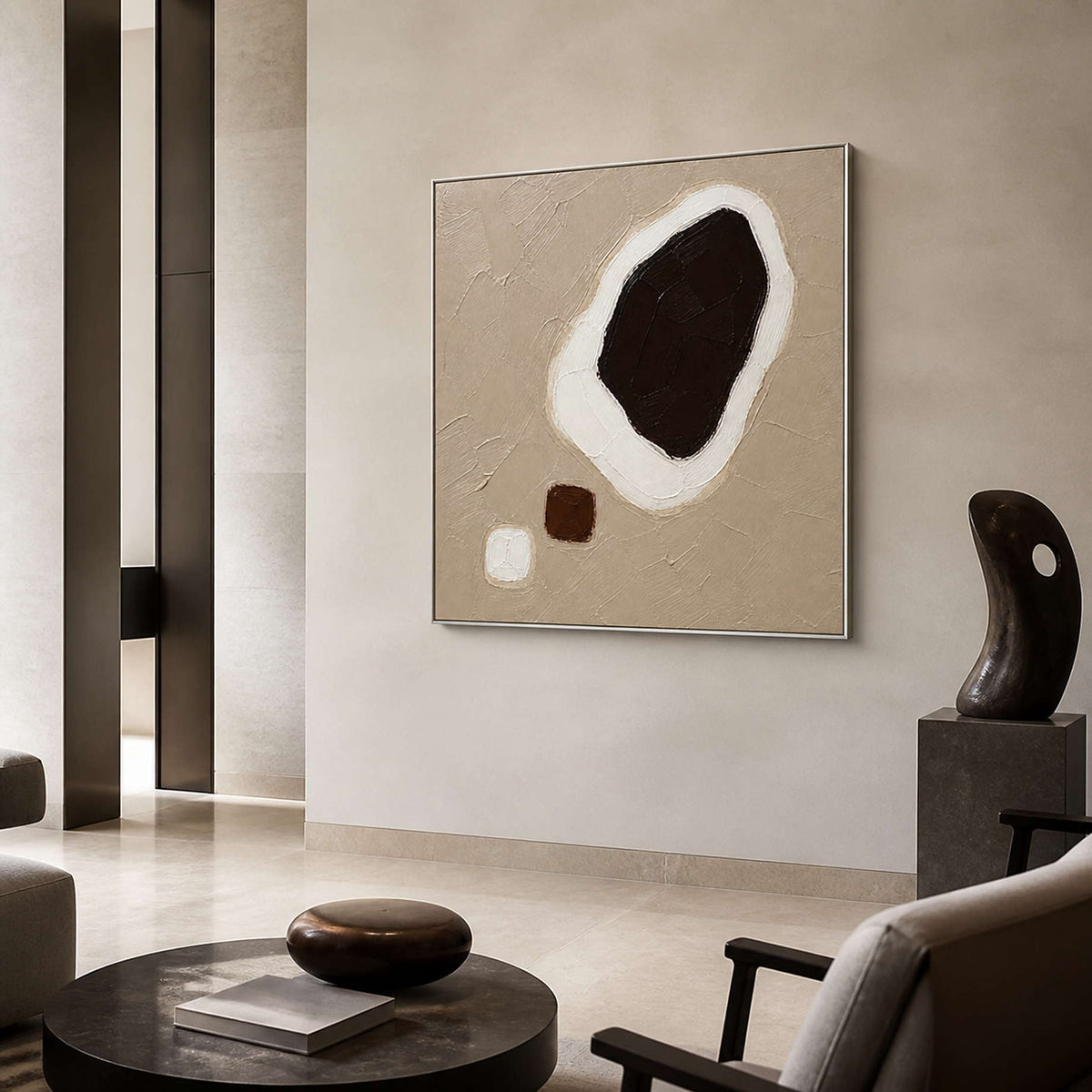 Dark Stone Held in White in a silver-framed lobby