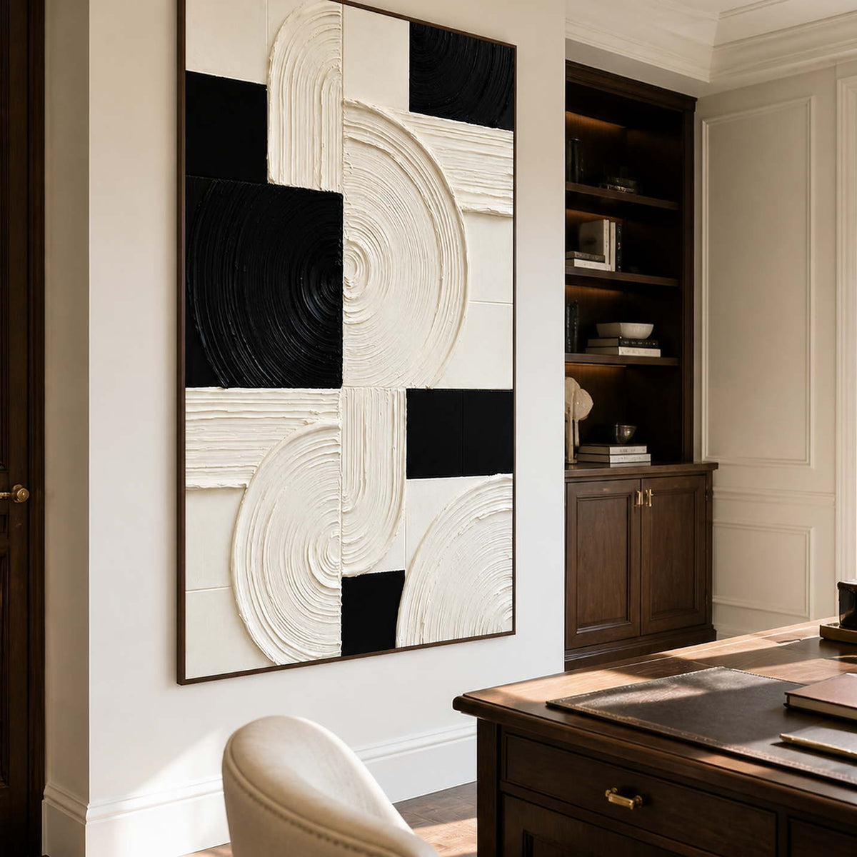 Wood framed textured arcs beside a writing desk and office bookshelves.