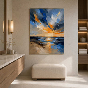 Luminous coastal wall art in a warm limestone hotel bathroom.