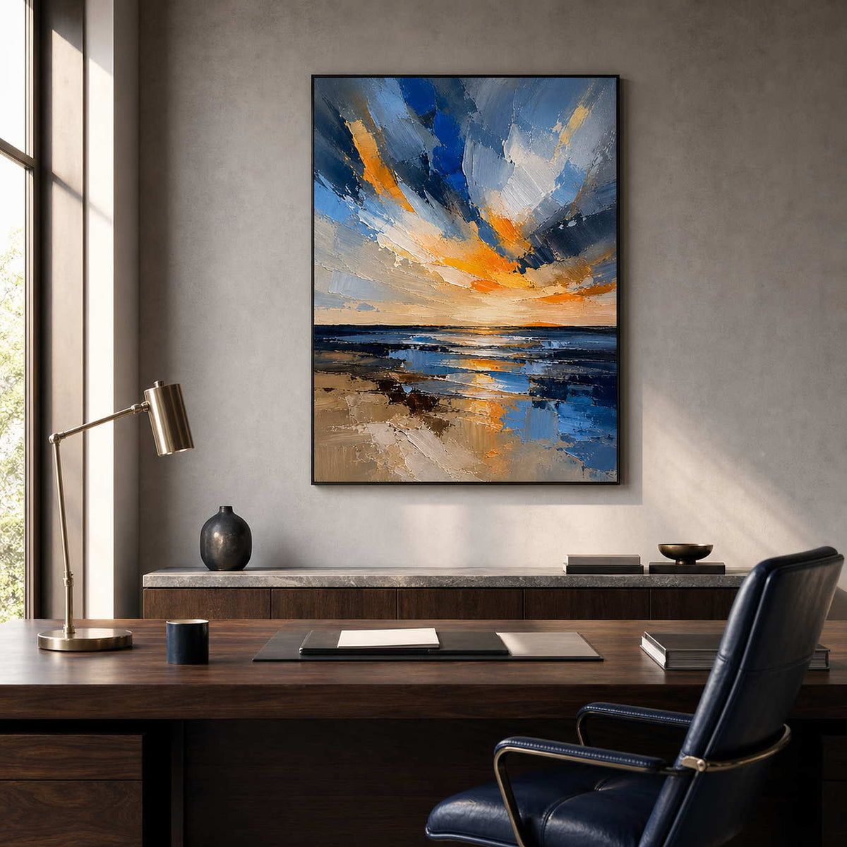 Textured sunrise artwork in a refined walnut and navy office.