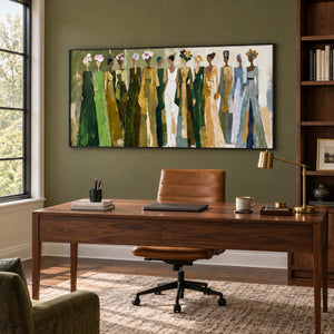 Days in Full Bloom in a black frame above a wood desk and tan leather chair against an olive wall.