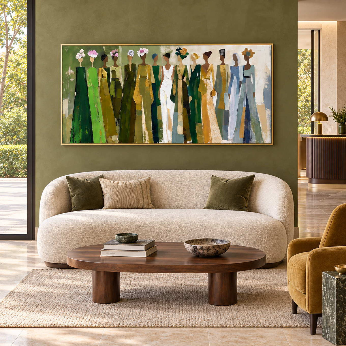 Days in Full Bloom in a gold frame above a rounded cream sofa and oval wood table in a green-walled lobby.