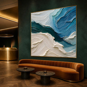 Blue and ivory coastal wall art in an emerald hotel lounge.