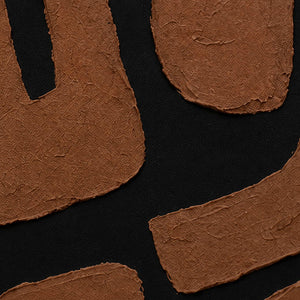 Close view of rust brown painted shapes with uneven edges over black canvas.