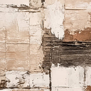 Close-up of scraped cream layers crossing dark brown ridges in abstract wall art.