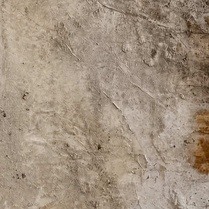 Close detail of fine cracks, rubbed gray layers, and subtle brown surface marks.