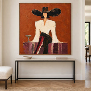 Cream-jacket portrait displayed over a slim black console.