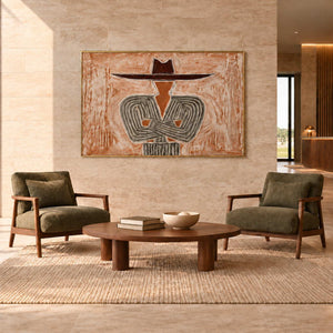 Effortless Poise in a gold frame above two olive armchairs and a low wood table in a commercial lobby.