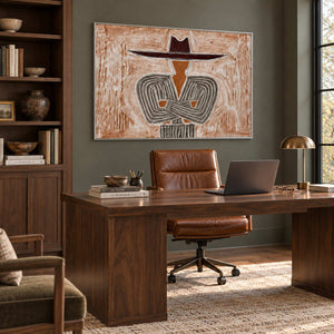 Effortless Poise in a silver frame above a wood desk and brown leather office chair beside bookshelves.