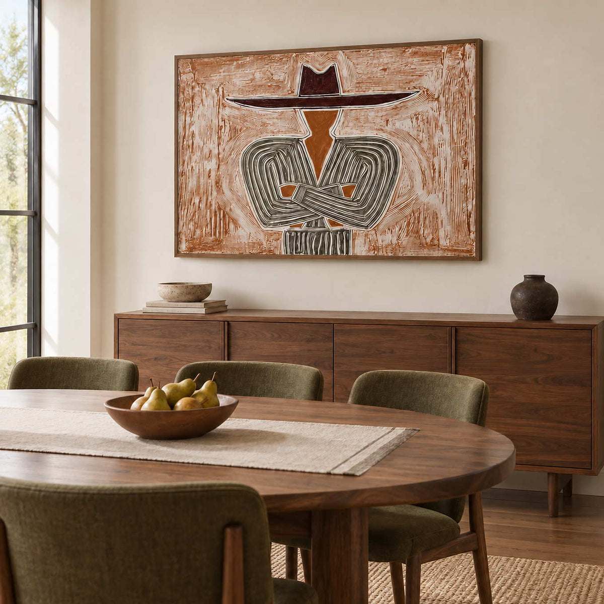 Effortless Poise in a wood frame above a sideboard behind a round wood dining table and olive chairs.