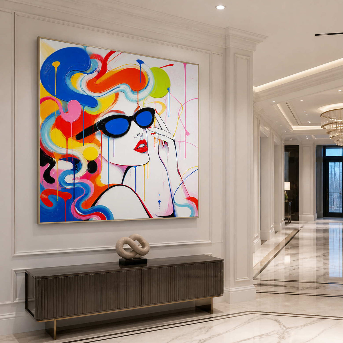 Square pop art portrait wall art in a bright entryway with a silver frame.