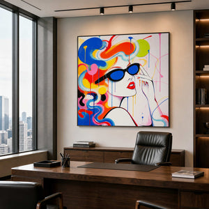 Bold colorful portrait wall art in a private office with a wood frame.